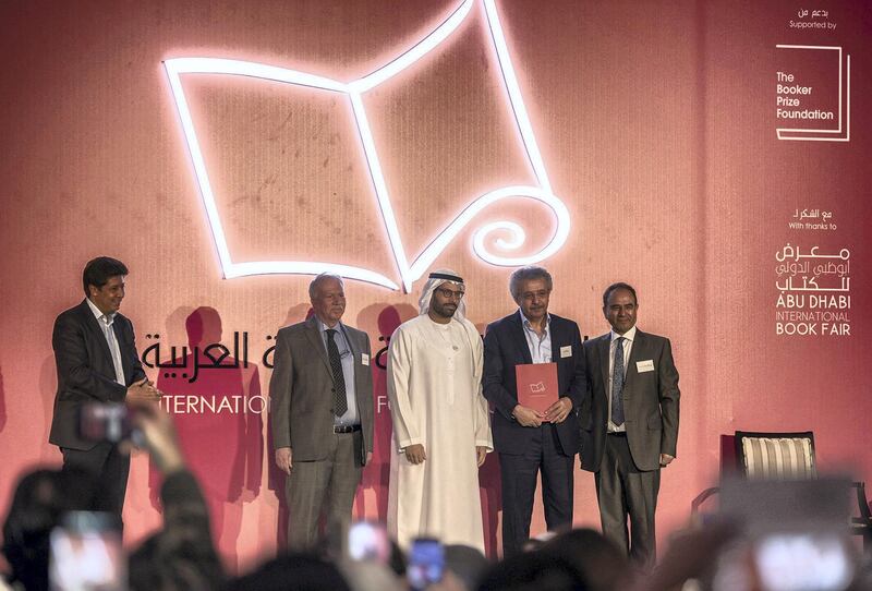 4 April 2018:From to left to right Ibrahim Al Saafin , HE Mohamed Khalifa Al Mubarak, Winner  Ibrahim Nasrallah for the "The Second War of the Dog"  Professor Yasir Suleiman of International Prize for Arabic Fiction which held at Abu Dhabi, UAE ,vidhyaa for The Nationa