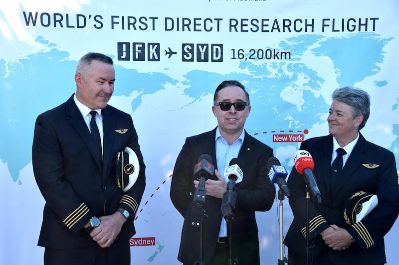 Qantas pilot Captain Sean Golding, group chief executive Alan Joyce and fleet manager Lisa Norman speak to the media after completing the flight. AFP