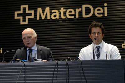 Brazil's national team doctor, Rodrigo Lasmar, right, and French doctor Gerard Saillant, representing PSG, spreak during a news conference at the Mater Dei Hospital, in Belo Horizonte, Brazil, Saturday, March 3, 2018. Neymar has successfully undergone surgery on his injured right foot, the Brazilian soccer confederation said Saturday. The 26-year-old Paris Saint-Germain and Brazil forward was injured Feb. 25 in a French league game against Marseille. (AP Photo/Eugenio Savio)