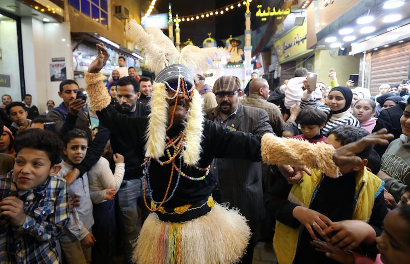 People celebrate along a street ahead of the holy month of Ramadan in Giza, Egypt. EPA