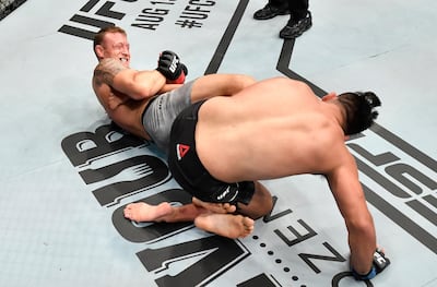 ABU DHABI, UNITED ARAB EMIRATES - JULY 19: In this handout image provided by UFC, (L-R) Jack Hermansson of Sweden secures a heel hook submission against Kelvin Gastelum in their middleweight bout during the UFC Fight Night event inside Flash Forum on UFC Fight Island on July 19, 2020 in Yas Island, Abu Dhabi, United Arab Emirates. (Photo by Jeff Bottari/Zuffa LLC via Getty Images)