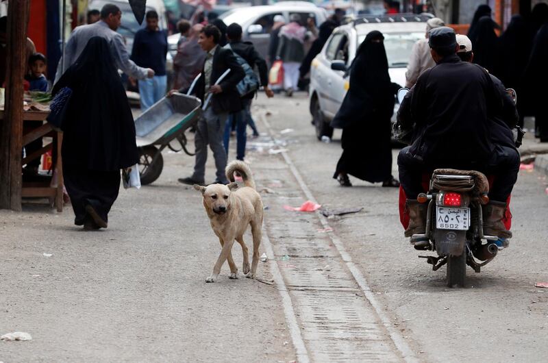 People walk through a street in Sanaa, Yemen.  EPA