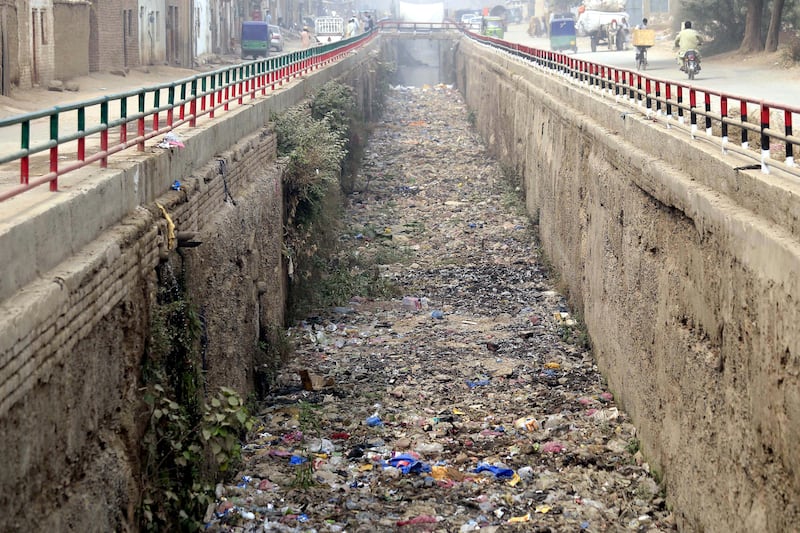 Litter clogs a sewer drain in Peshawar, Pakistan. EPA