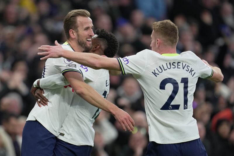 Harry Kane celebrates with teammates after scoring the opening goal. AP