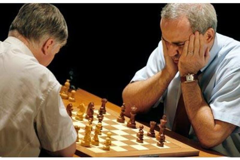 Anatoly Karpov, left, and Garry Kasparov faced each other again last September, 25 years after their epic duel. Jose Jordan / AFP