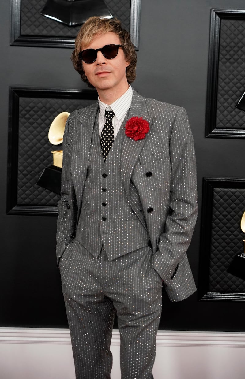 Beck wears a grey suit by Celine for the 62nd Grammy Awards. Reuters