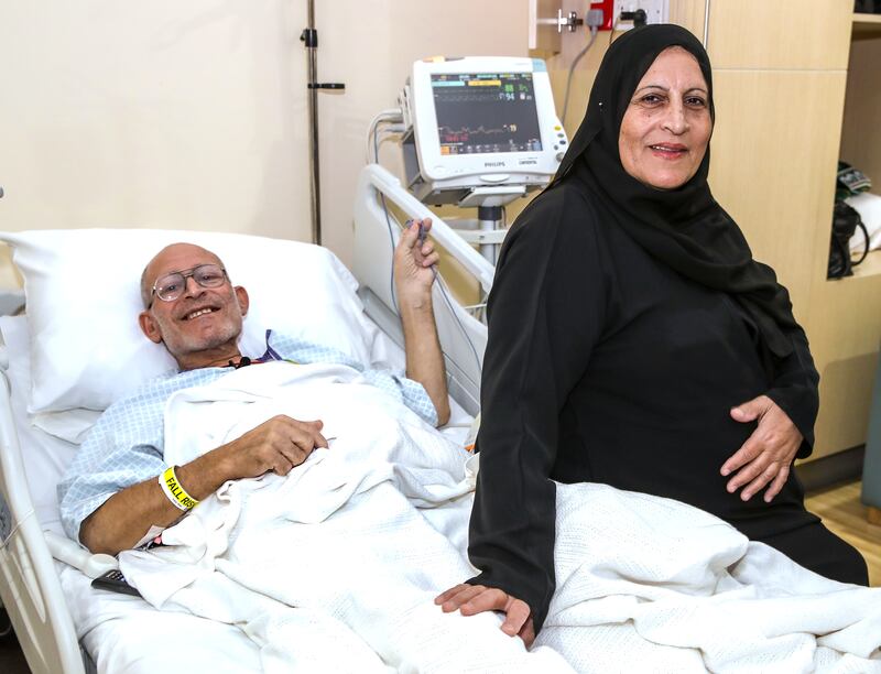 Awni Qaddur Saleh, 63, who is being treated for lung cancer at an Abu Dhabi hospital, with his wife Fatiyeh. All photos: Victor Besa / The National