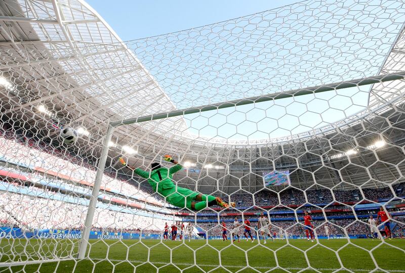 Aleksandar Kolarov of Serbia scores his team's first goal past Keylor Navas of Costa Rica from a free kick. Dean Mouhtaropoulos / Getty Images