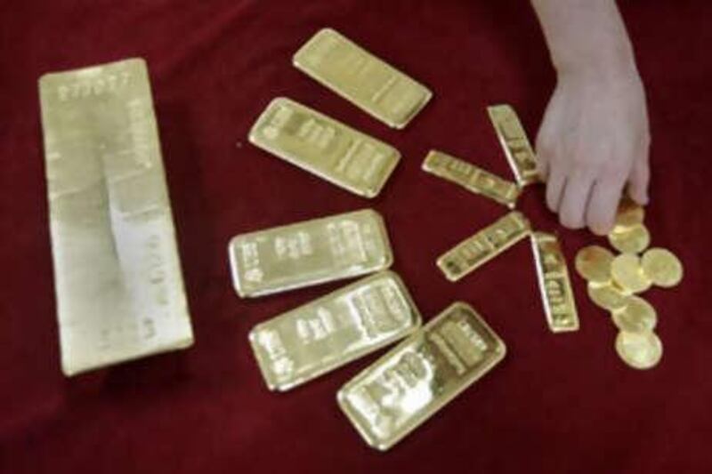 Gold ingots on display. DGCX reported almost 137,000 contracts last month.