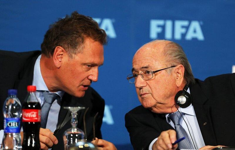 Former Fifa president Sepp Blatter, right, talks with secretary general Jerome Valcke during a news conference in 2014. EPA