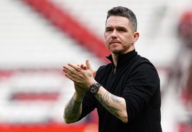 Manchester United manager Marc Skinner applauds the fans. PA