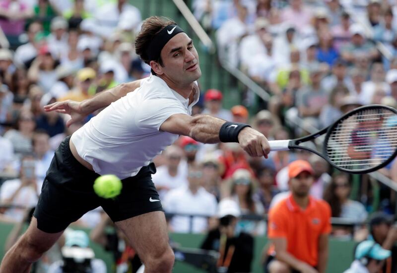 Roger Federer, of Switzerland, goes to the net against Thanasi Kokkinakis, of Australia, during the Miami Open tennis tournament, Saturday, March 24, 2018, in Key Biscayne, Fla. (AP Photo/Lynne Sladky)