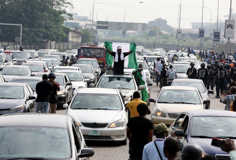 Cars lined up in a procession through the streets to mark the first anniversary of the EndSARS protest at the Lekki Toll Gate. Reuters