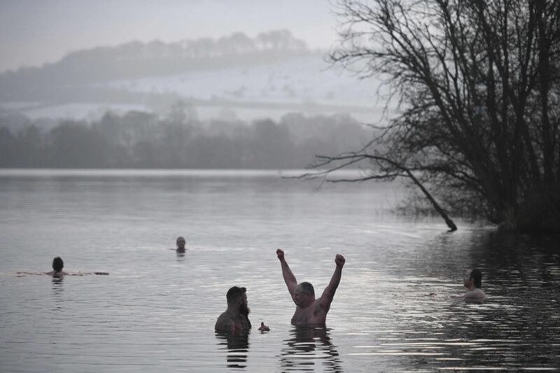 Individuals brave the freezing temparature in Combs reservoir on New Year's Day, northwest England. AFP