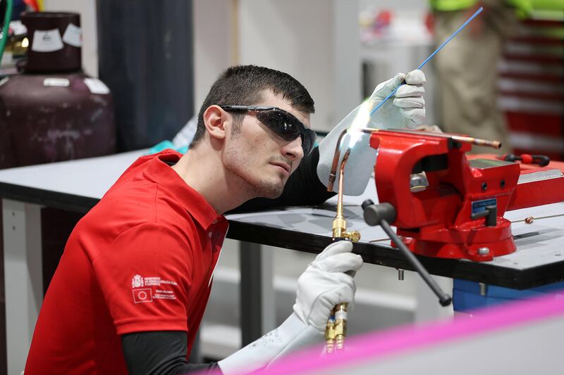 ABU DHABI , UNITED ARAB EMIRATES , OCT 14   – 2017 :- Emanuel Budeanu from Spain team at the Refrigeration and Air Conditioning stand preparing for the WorldSkills Abu Dhabi 2017 held at ADNEC in Abu Dhabi.  (Pawan Singh / The National) Story by Roberta