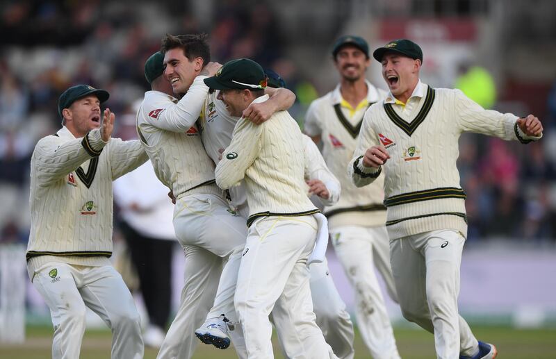 MANCHESTER, ENGLAND - SEPTEMBER 07: Australia bowler Pat Cummins celebrates with team mates after dismissing Joe Root for 0 during day four of the 4th Ashes Test Match between England and Australia at Old Trafford on September 07, 2019 in Manchester, England. (Photo by Stu Forster/Getty Images)