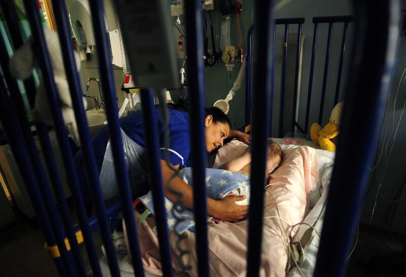 A nurse comforts a patient at Great Ormond Street Hospital for Children. Dylan Martinez / Reuters