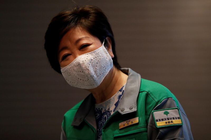 FILE PHOTO: Tokyo Governor Yuriko Koike wears a protective face mask during a press preview of a hotel of APA Group that has been designated to accommodate asymptomatic people and those with light symptoms of the coronavirus disease (COVID-19) to free up hospital beds and alleviate work by nurses and staff members, in Tokyo, Japan May 1, 2020. REUTERS/Issei Kato/File Photo