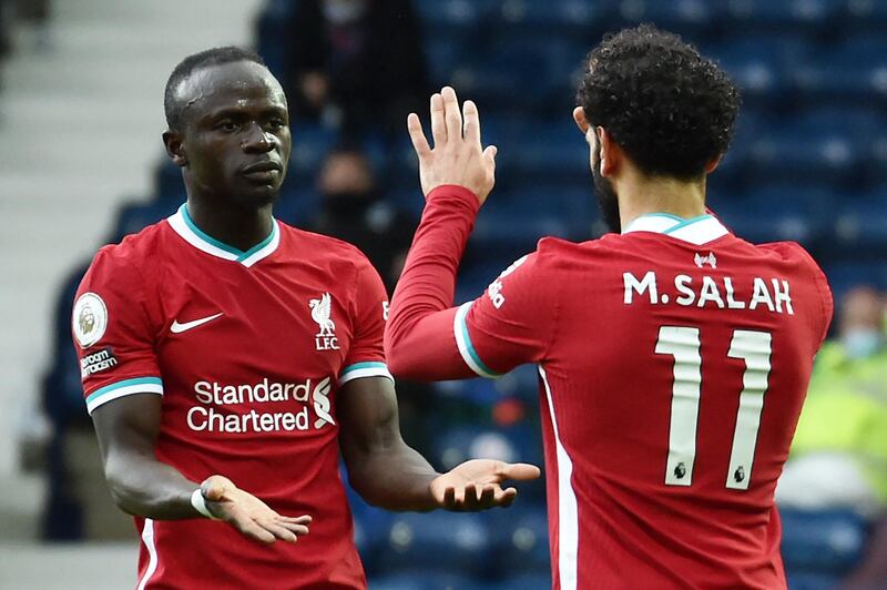 Liverpool's Mohamed Salah celebrates with Sadio Mane after scoring. AFP