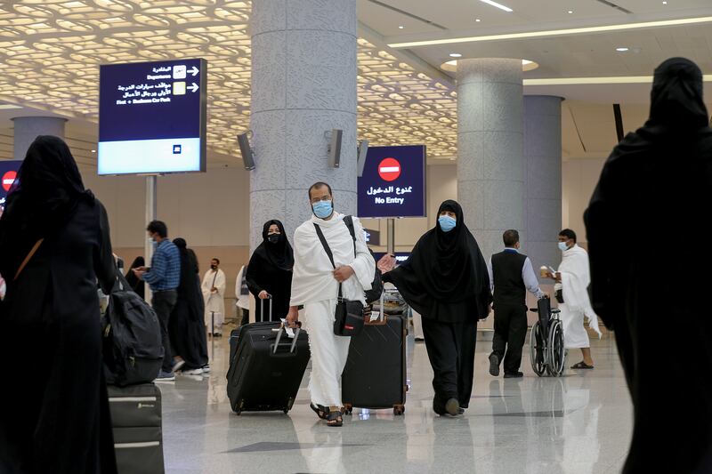 Pilgrims arrive at King Abdulaziz International Airport for the annual Hajj pilgrimage, in Jeddah, Saudi Arabia, July 17, 2021.  Reuters