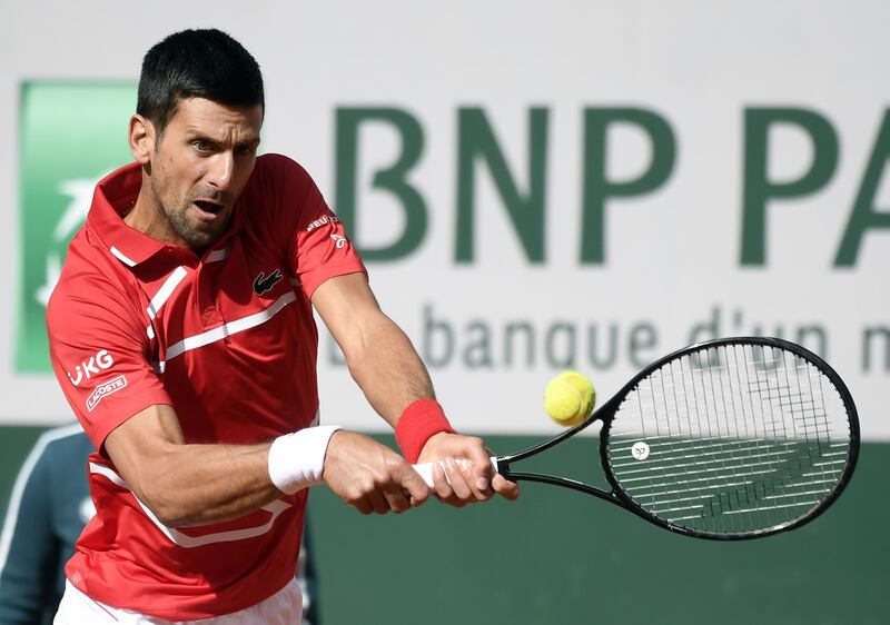 epa08712113 Novak Djokovic of Serbia in action against Ricardas Berankis of Lithuania during their men’s second round match during the French Open tennis tournament at Roland ​Garros in Paris, France, 01 October 2020.  EPA/JULIEN DE ROSA