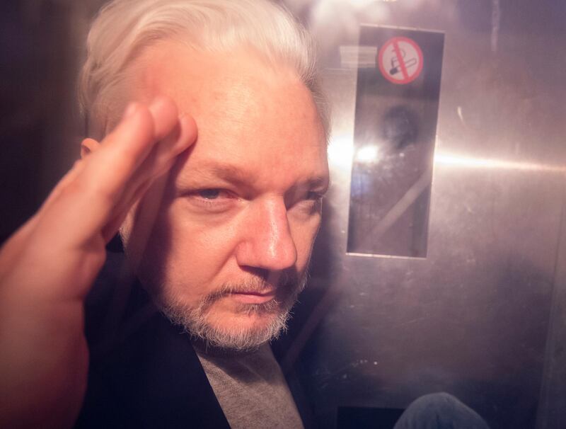 epa07622698 (FILE) - Wikileaks co-founder Julian Assange, in a prison van, as he leaves Southwark Crown Court in London, Britain, 01 May 2019 (reissued 03 June 2019). Reports on 03 June 2019 state Uppsala District Court in Uppsala, Sweden, 03 June 2019 denied a request of  detention of Julian Assange in absentia on rape allegations. Assange was arrested at Ecuadorean embassy in March 2019.  EPA/NEIL HALL