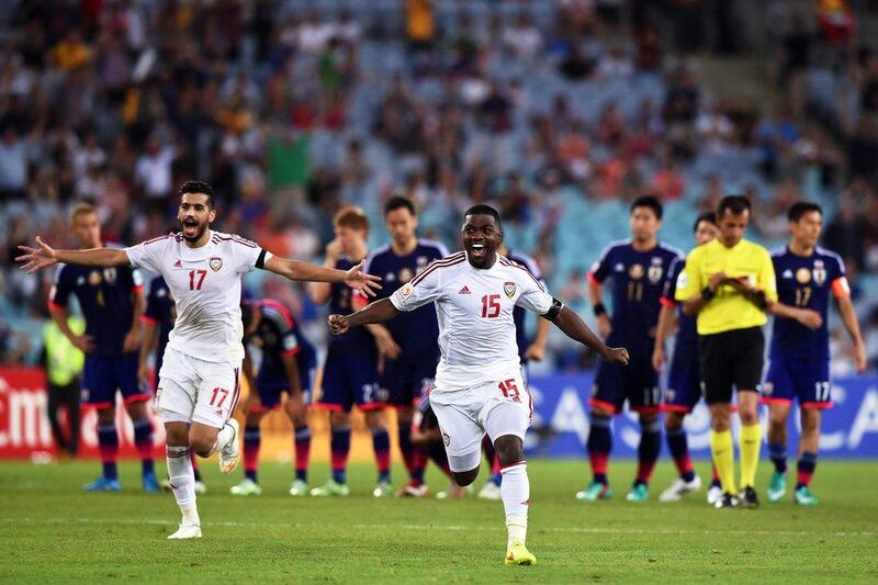 UAE players Ismail Al Hammadi, right, and Majed Hassan, left, celebrate after winning the penalty shootout against Japan on Friday in the Asian Cup quarter-finals. Paul Miller / EPA