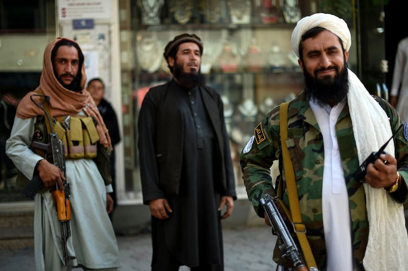 Taliban fighters stand guard. Photo: AFP