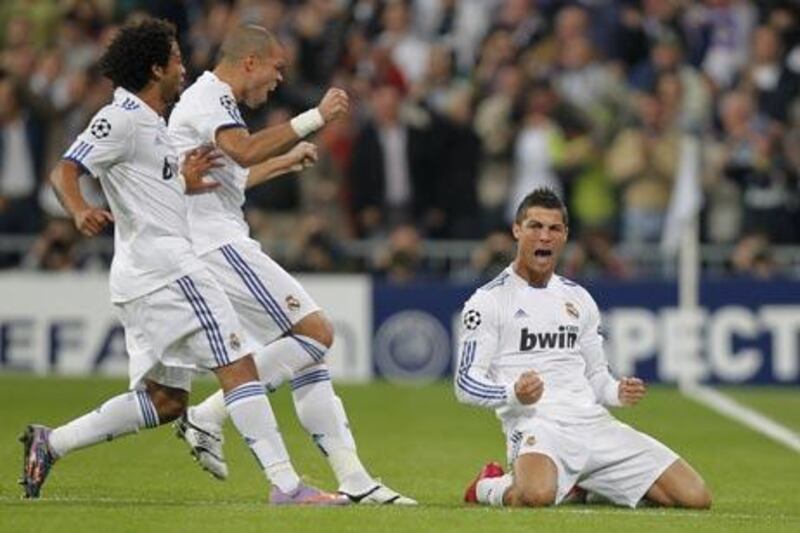 Cristiano Ronaldo celebrates after scoring against AC Milan.