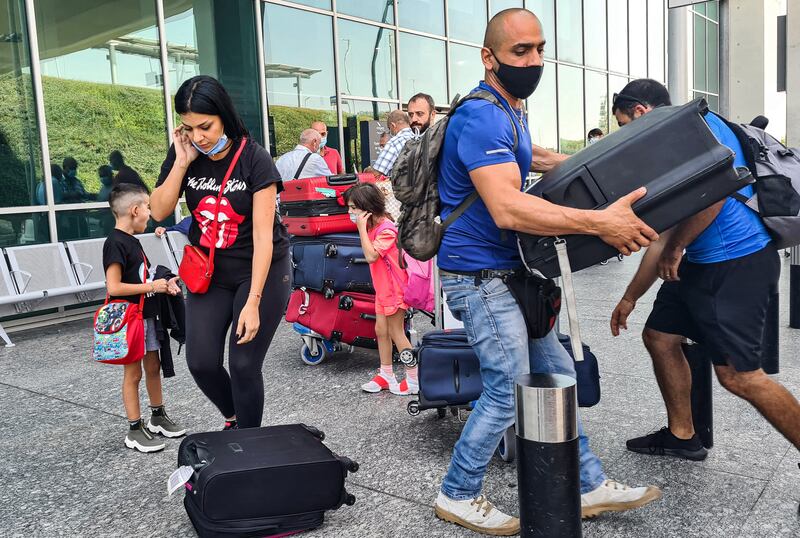 A Lebanese family arrives at Larnaca International Airport in September ahead of the start of the school year as fears that increasing fuel shortages and electricity black-outs in Lebanon spurred many to seek a more stable education for their children elsewhere. AFP