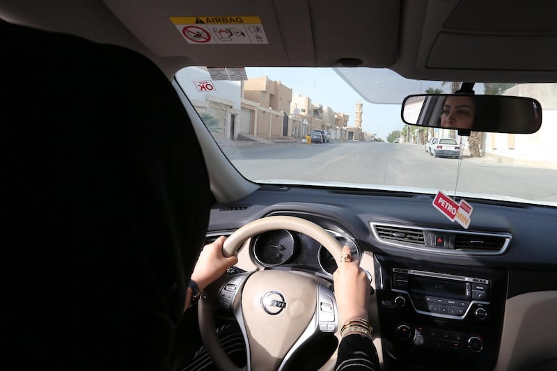 epa06836503 Huda al-Badri, 30, poses behind a steering wheel as women are alowed to drive for the first time through the streets of the capita, Riyadh, Saudi Arabia, in the early morning hours of 24 June 2018 when the royal decree lifted the ban on women driving a car in Saudi Arabia. Women in Saudi Arabia took the wheel early on Sunday after lifting the decades-old ban as part of a liberation campaign in the conservative kingdom.  EPA/AHMED YOSRI