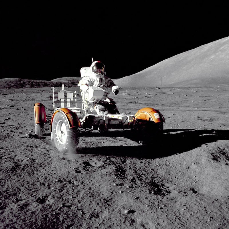 A handout photo of astronaut Eugene A. Cernan, Apollo 17 mission commander, makes a short checkout of the Lunar Roving Vehicle during the early part of the first Apollo 17 extravehicular activity (EVA-1) at the Taurus-Littrow landing site. This view of the "stripped down" Rover is prior to loadup. This photograph was taken by Geologist-Astronaut Harrison H. Schmitt, Lunar Module pilot. The mountain in the right background is the East end of South Massif. (Couretsy: NASA)

NASA Identifier: GPN-2000-001139 *** Local Caption ***  lunar-rover01.jpg
