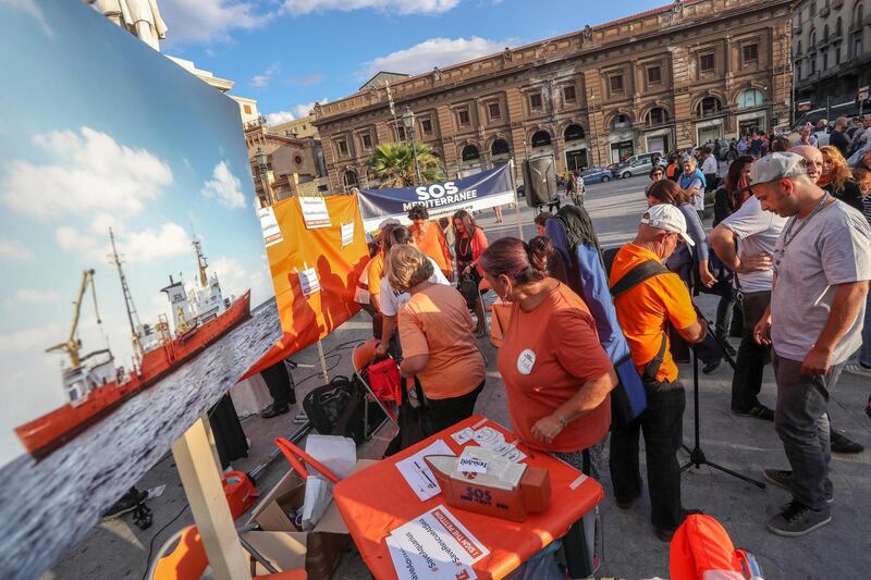 epa07074575 Protesters gather during a demonstration in support of NGO 'SOS Mediterrannee' and their flagship vessel, the rescue ship MV Aquarius, in Palermo, Sicily island, Italy, 06 October 2018. Reports state that Panamanian authorities have revoked the registration of the Aquarius, the last migrant rescue ship operating in the central Mediterranean - actions which hinder the NGO's abilities to continue rescue operations at sea. The operators of the vessel have accused Panama of bowing to pressure from the Italian government.  EPA/IGOR PETYX