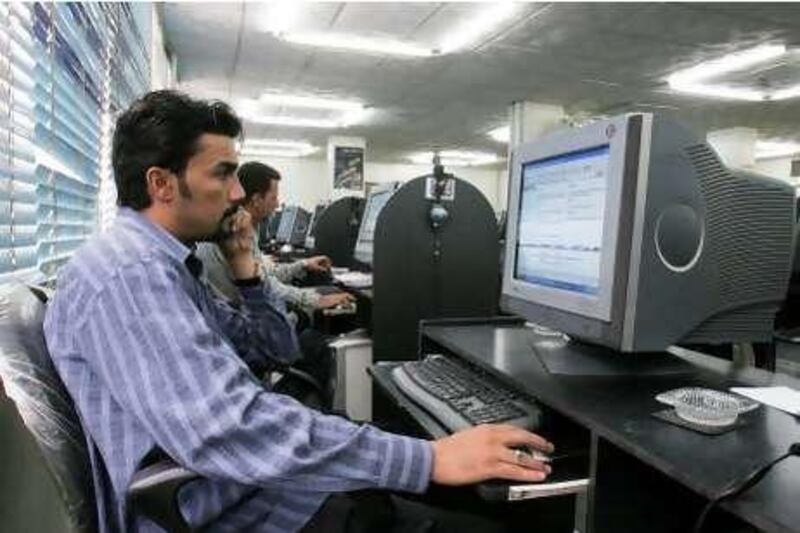 FILE - In this April 3, 2006 file photo, Iraqi man makes use of one of the many Internet cafes in Baghdad, Iraq. Iraq's government has decided to crack down on Internet service providers and ban websites that incite violence or carry pornography, a communications ministry spokesman said Tuesday, Aug. 4, 2009. (AP Photo,File)