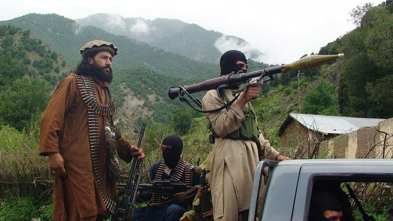 Pakistani Taliban patrol in the tribal areas near the border with Afghanistan on August 5, 2012. Ishtiaq Mahsud / AP Photo 