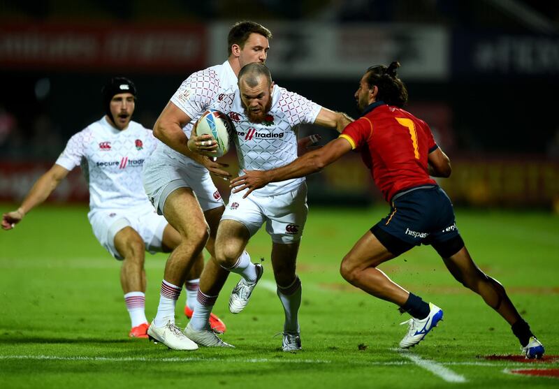 Tom Bowen of England is tackled by Pol Pla of Spain on day one of the HSBC World Rugby Sevens Series in Dubai. Getty