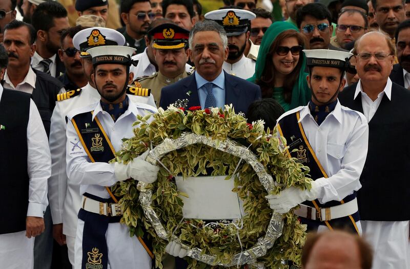 Mohammad Zubair Umar (C), Governor of Sindh province walks with Pakistan's naval officers to lay a wreath during a ceremony to celebrate the country's 70th Independence Day at the mausoleum of Muhammad Ali Jinnah in Karachi, Pakistan August 14, 2017. REUTERS/Akhtar Soomro
