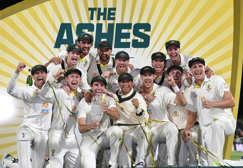 Australia celebrate winning the Ashes series 4-0 after beating England in the fifth Test in Hobart on Sunday, January 16, 2022. PA