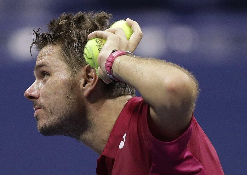 Stan Wawrinka, of Switzerland, prepares to hit balls into the crowd after defeating Kei Nishikori, of Japan, during the semi-finals of the US Open on Friday, September 9, 2016, in New York. Charles Krupa / AP Photo