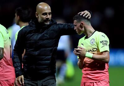 Manchester City manager Pep Guardiola (left) and player Phil Foden celebrate after the final whistle during the Carabao Cup, Third Round match at Deepdale Stadium, Preston. PA Photo. Picture date: Tuesday September 24, 2019. See PA story SOCCER Preston. Photo credit should read: Richard Sellers/PA Wire. RESTRICTIONS: EDITORIAL USE ONLY No use with unauthorised audio, video, data, fixture lists, club/league logos or "live" services. Online in-match use limited to 120 images, no video emulation. No use in betting, games or single club/league/player publications.