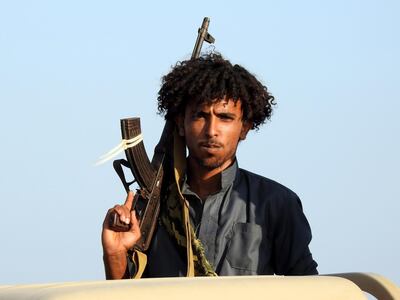 epa07262148 A Yemeni pro-government soldier holds a gun at a position during a ceasefire in the port city of Hodeidah, Yemen, 04 January 2019.  According to reports, UN envoy for Yemen Martin Griffiths will travel to the Yemeni capital Sanaâ€™a and the Saudi capital Riyadh in the coming days to hold a new round of talks with Houthi rebels and the Saudi-backed Yemeni government as the cessation in Hodeidah continues to hold.  EPA/NAJEEB ALMAHBOOBI