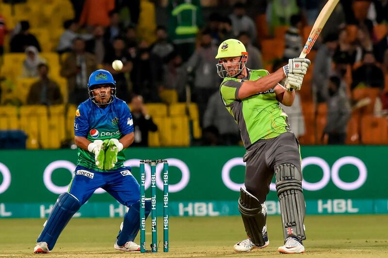 Lahore Qalandars' Chris Lynn (R) plays a shot during the Pakistan Super League (PSL) T20 cricket match between Multan Sultans and Lahore Qalandars at the Gaddafi Cricket Stadium in Lahore on February 21, 2020.  / AFP / Arif ALI
