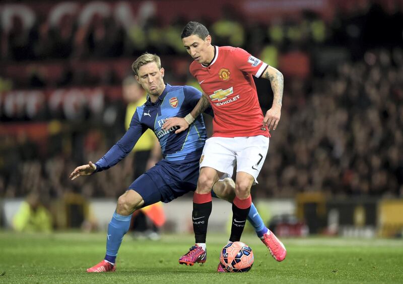 MANCHESTER, ENGLAND - MARCH 09:  Angel di Maria of Manchester United is challenged by Nacho Monreal of Arsenal during the FA Cup Quarter Final match between Manchester United and Arsenal at Old Trafford on March 9, 2015 in Manchester, England.  (Photo by Michael Regan/Getty Images)