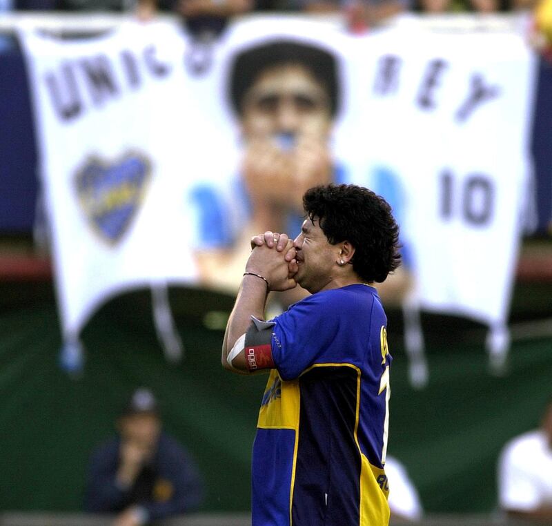 Former Argentine soccer star Diego Maradona is overcome with emotion during an event in his honor at the "La Bombonera" stadium of Boca Juniors soccer team 10 November 2001 in Buenos Aires.    AFP PHOTO/Ali BURAFI (Photo by ALI BURAFI / AFP)