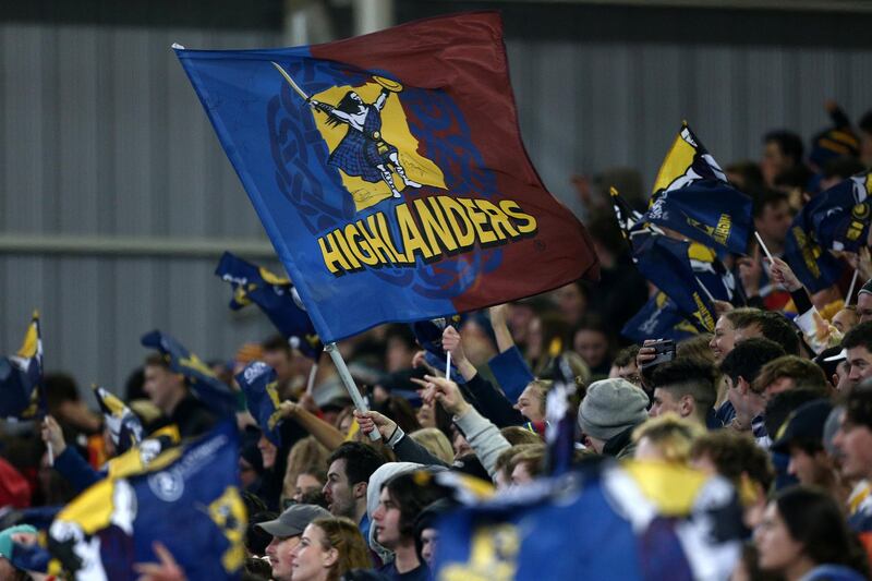 A Highlanders supporter waves a flag during the Super Rugby match between the Highlanders and Chiefs on Saturday in Dunedin, New Zealand. The country has been declared Covid-19 free.  Getty