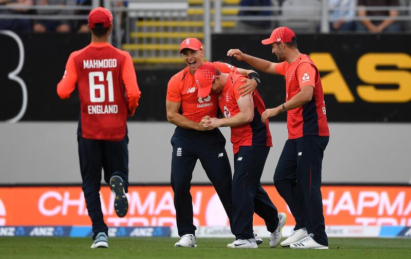 AUCKLAND, NEW ZEALAND - NOVEMBER 10: Eoin Morgan celebrates with teammates after catching out Tim Seifert of New Zealand during game five of the Twenty20 International series between New Zealand and England at Eden Park on November 10, 2019 in Auckland, New Zealand. (Photo by Gareth Copley/Getty Images)