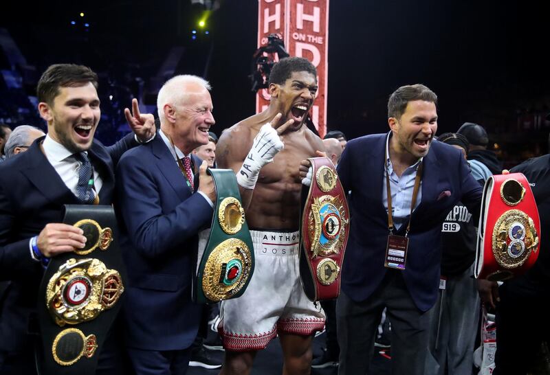 Anthony Joshua with Eddie Hearn (right) and Barry Hearn (2nd left) after reclaiming the IBF, WBA, WBO & IBO World Heavyweight Championship belts from Andy Ruiz (not pictured) at the Diriyah Arena, Diriyah, Saudi Arabia. PA Photo. Picture date: Saturday December 7, 2019. See PA story BOXING Saudi Arabia. Photo credit should read: Nick Potts/PA Wire