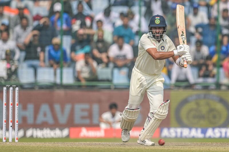 India's Cheteshwar Pujara plays a shot on his way to an unbeaten 31. AFP