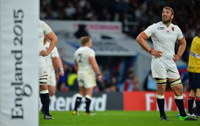 England captain Chris Robshaw, right, looks on as the hosts fell in the group stage of the Rugby World Cup. Glyn Kirk / AFP

