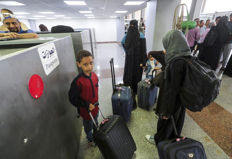 Passengers waiting to present their travel documents before passport control in Aden International Airport. AFP